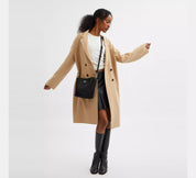 Coach bucket City Small en lona de firma Negra