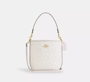 Coach bucket City Small en lona de firma Blanca