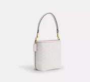 Coach bucket City Small en lona de firma Blanca