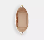 Coach bucket City Small en lona de firma Blanca