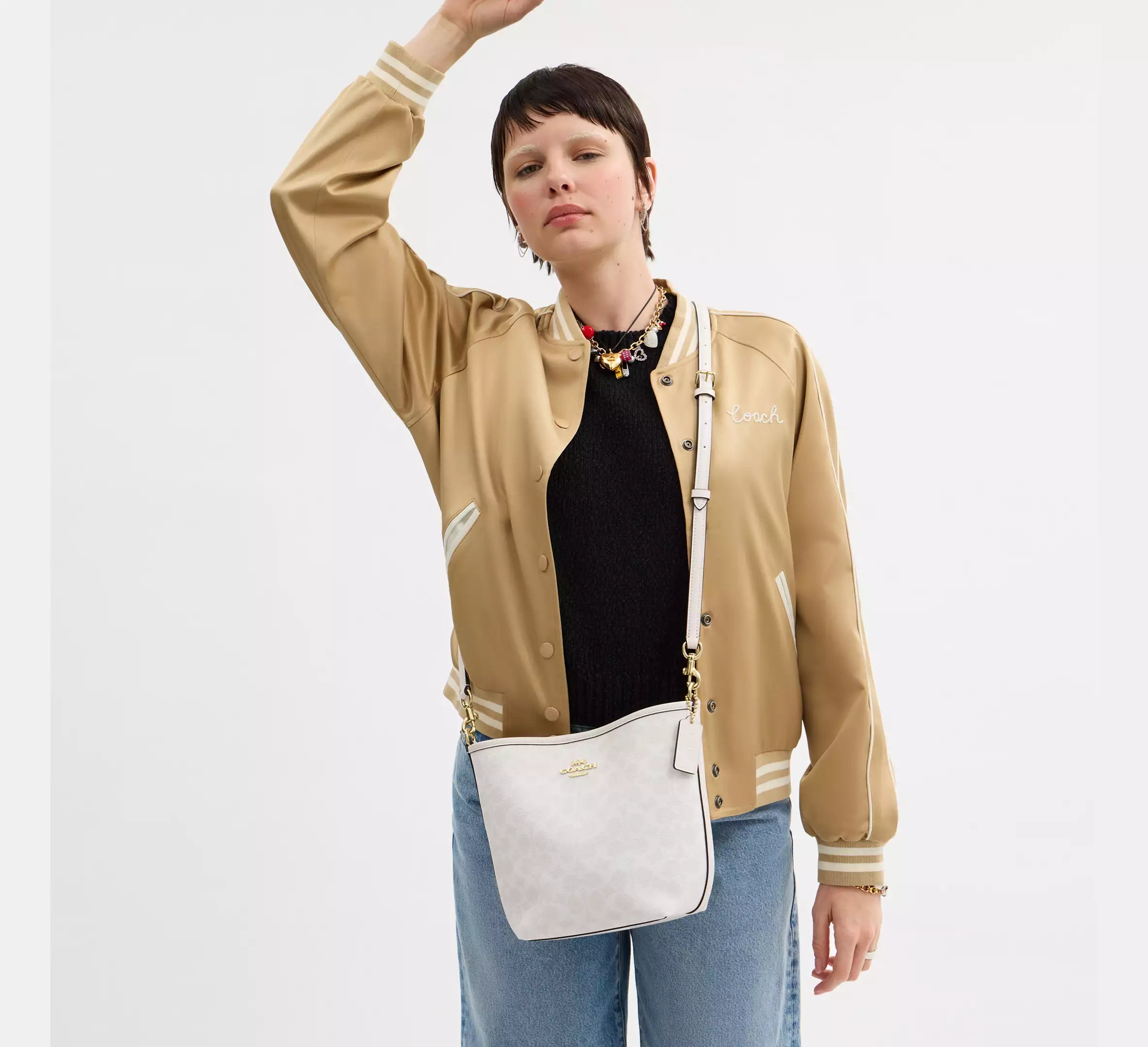 Coach bucket City Small en lona de firma Blanca